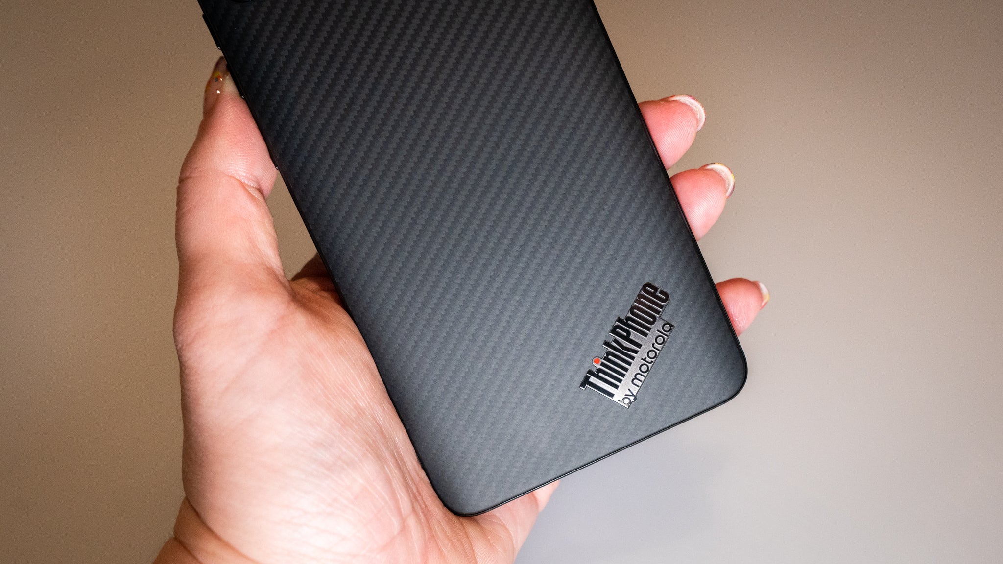 The back of the ThinkPhone looks like a shrunken ThinkPad.  (Photo: Florence Ion / Gizmodo)