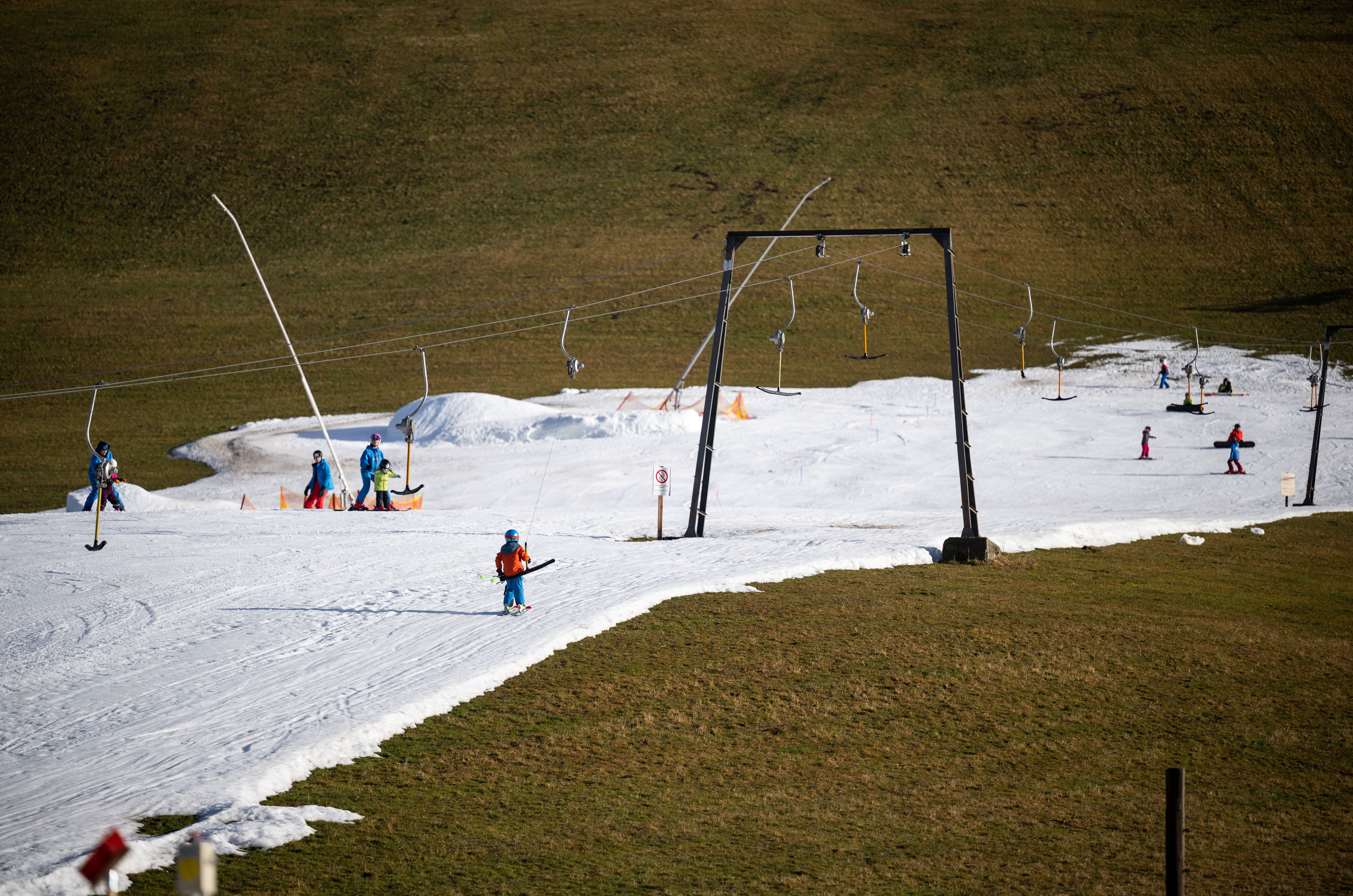 Skiiers on a slope covered in artificial snow in Filzmoos, Austria. (Photo: Daniel Kopatsch, Getty Images)