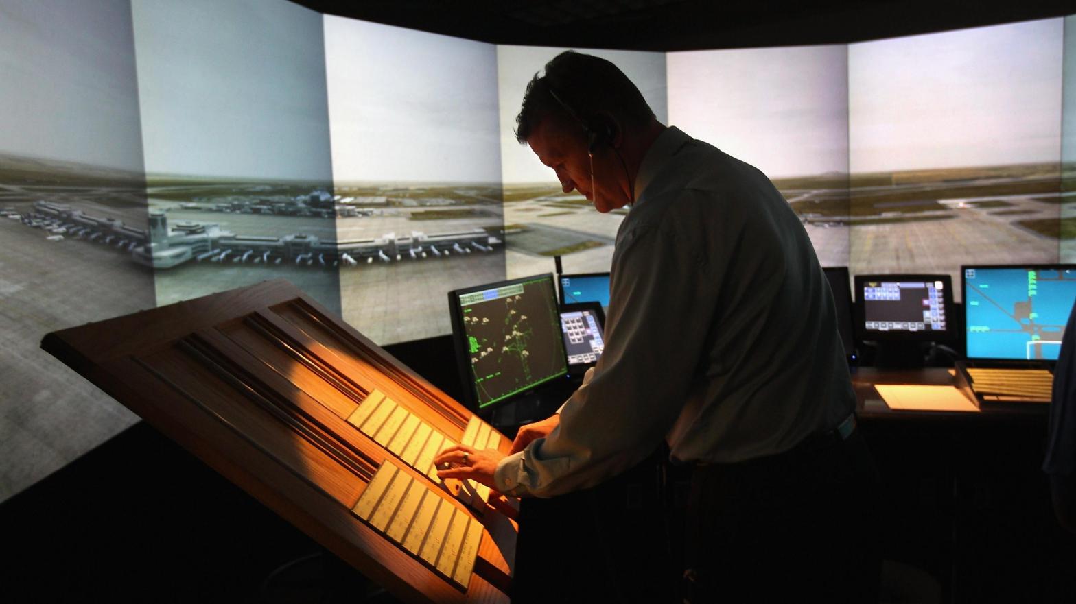 An air traffic controller works inside an airport tower simulator on July 14, 2011 at the Denver International Airport in Denver, Colorado (Photo: John Moore, Getty Images)