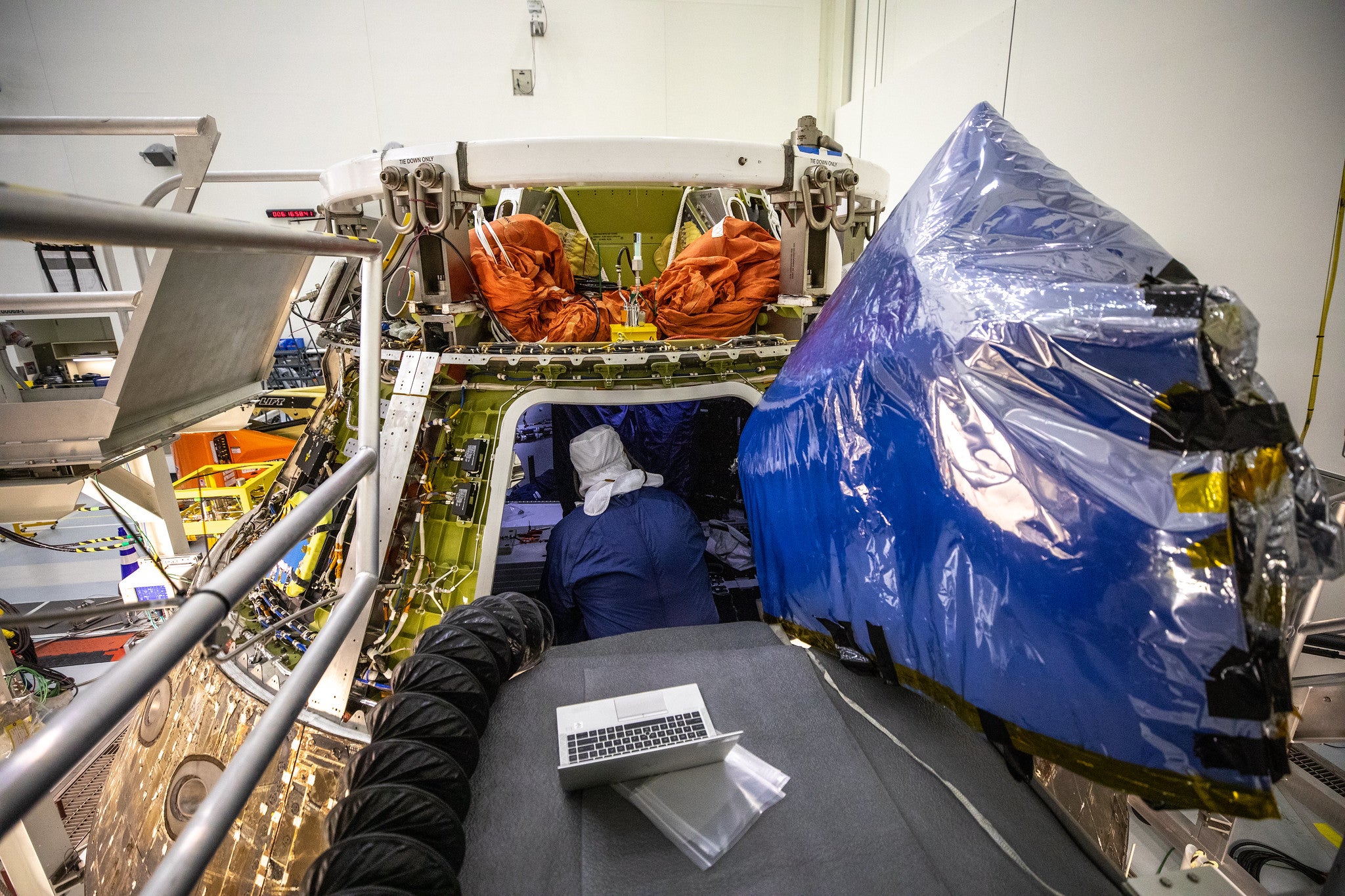 A technician unpacking Orion inside the Multi-Payload Processing Facility at Kennedy Space Centre on January 6, 2023.  (Photo: NASA)