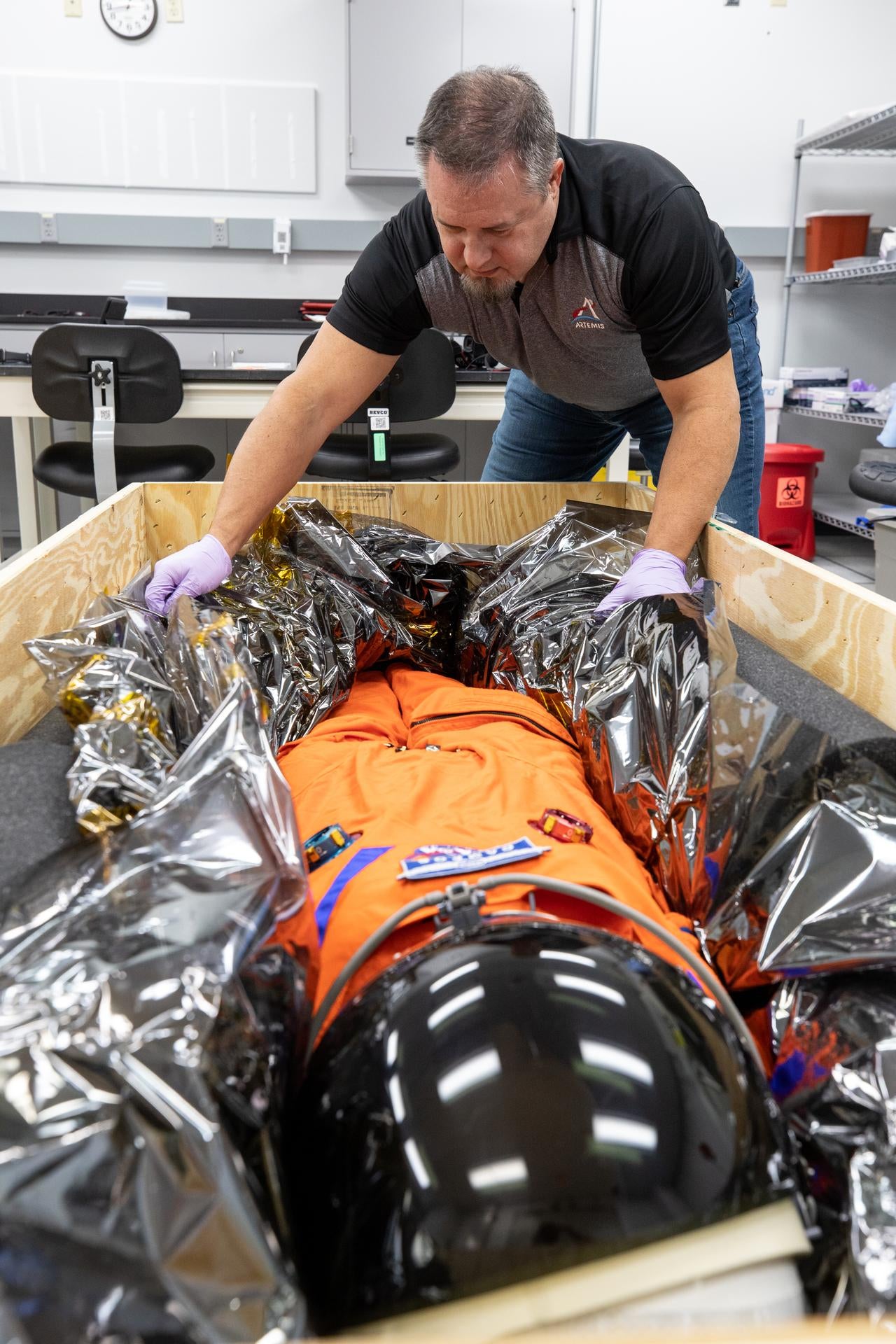 Joe Leblanc, Orion payload and cargo manager with Lockheed Martin, secures Commander Moonikin Campos for its trip to NASA's Johnson Space Centre in Houston. (Image: NASA/Cory Huston)