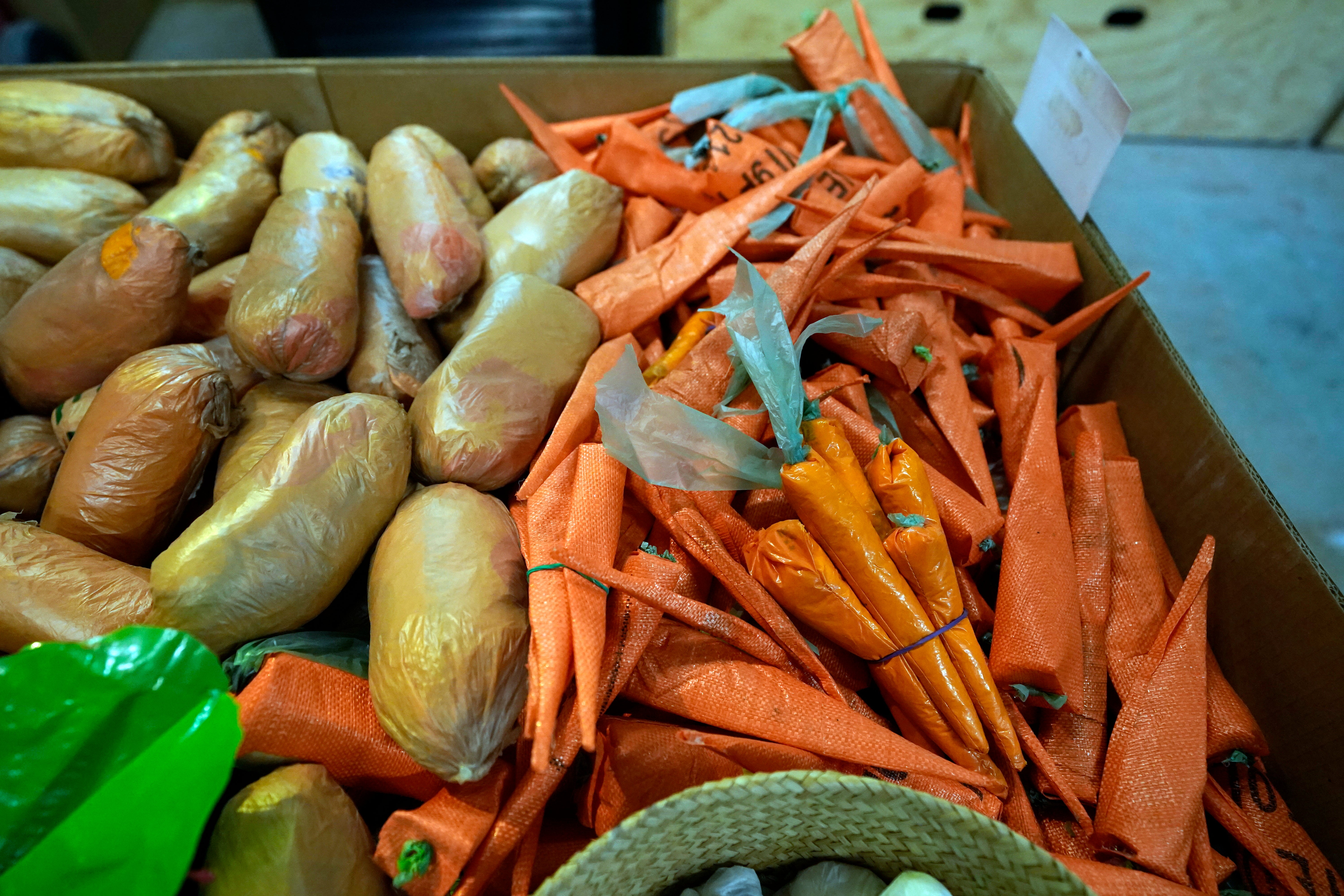 Potatoes and carrots....made of trash. (Photo: Carlos Osorio, AP)