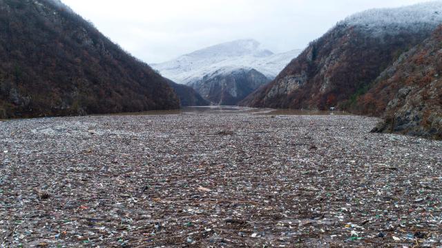Huge Trash Buildup Totally Covers Section of Balkan River