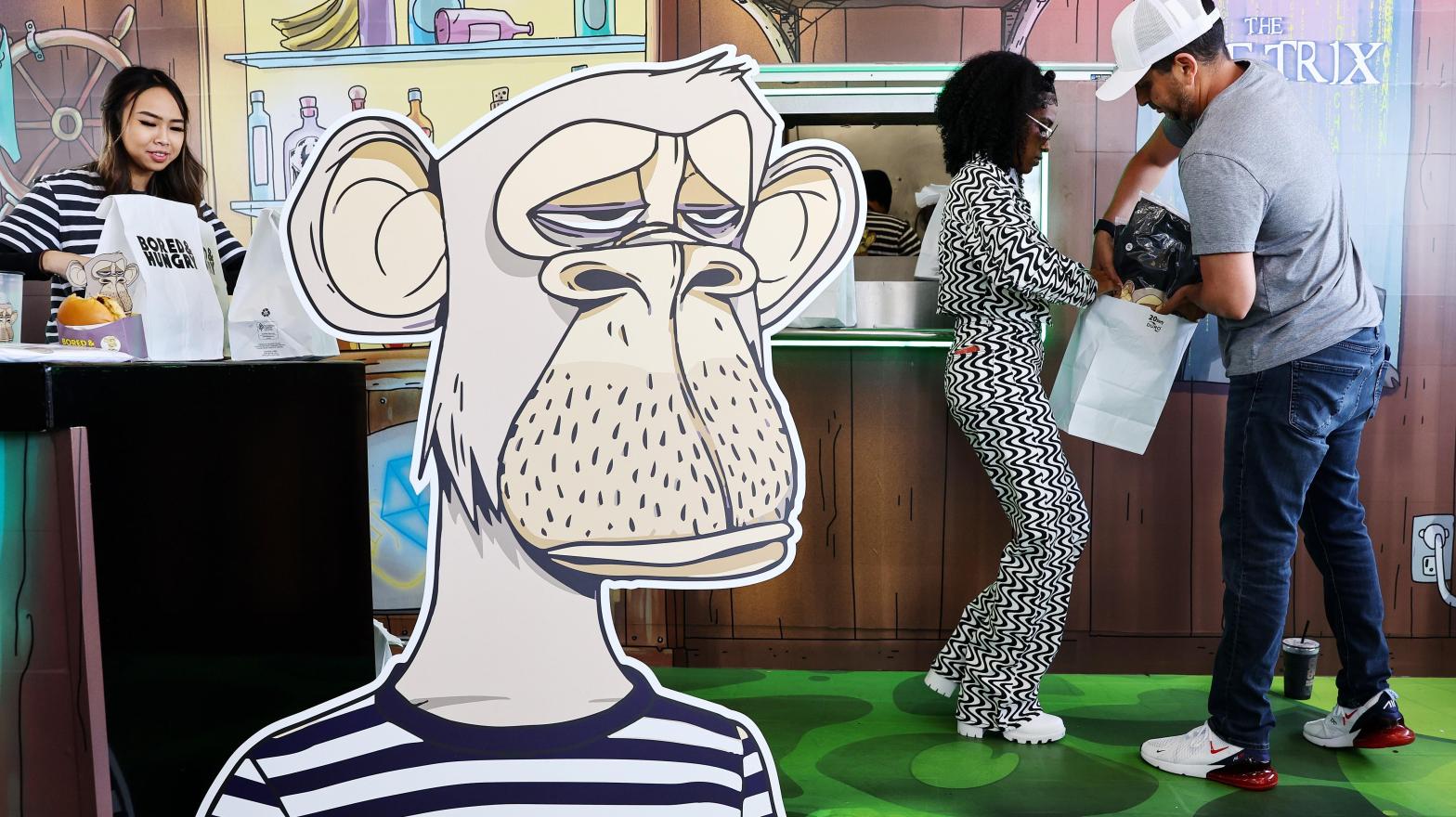 The BAYC community is granted the ability to commercially use their NFTs, such as for a pop up burger joint in California. Critics have said Yuga Labs doesn't grant ownership, so much as a licence for their ape. (Photo: Mario Tama, Getty Images)