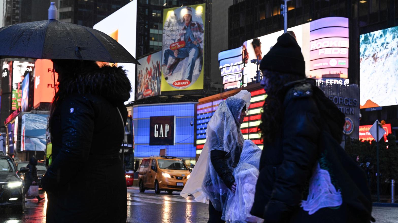 People walk in the rain in Times Square late last month.  (Photo: NDZ/STAR MAX/IPx, AP)