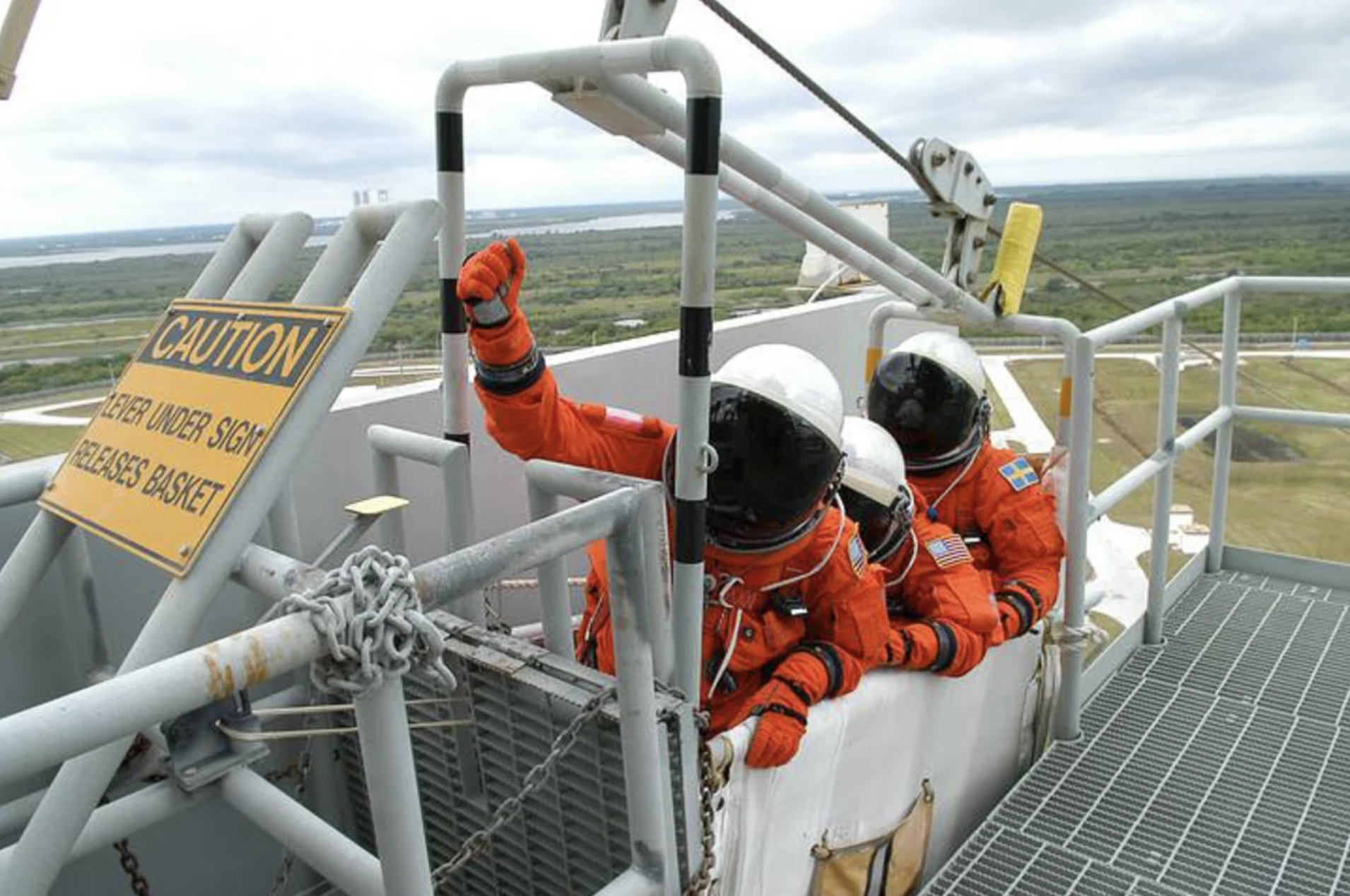 File photo from 2006 showing Space Shuttle astronauts practicing an emergency escape with the egress system on Launch Pad 39B.  (Photo: NASA/Kim Shiflett)