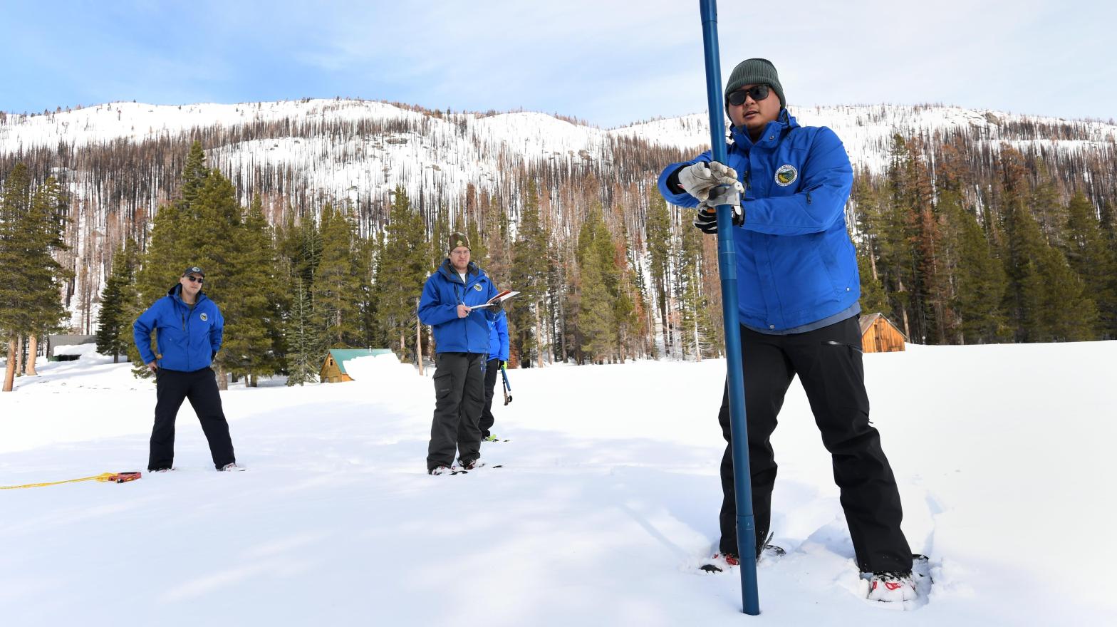 Department of Water Resources employees measure snow depth at Phillips Station in the Sierra Nevada Mountains on Feb 1, 2023 (Photo: Kenneth James / California Department of Water Resources, Fair Use)