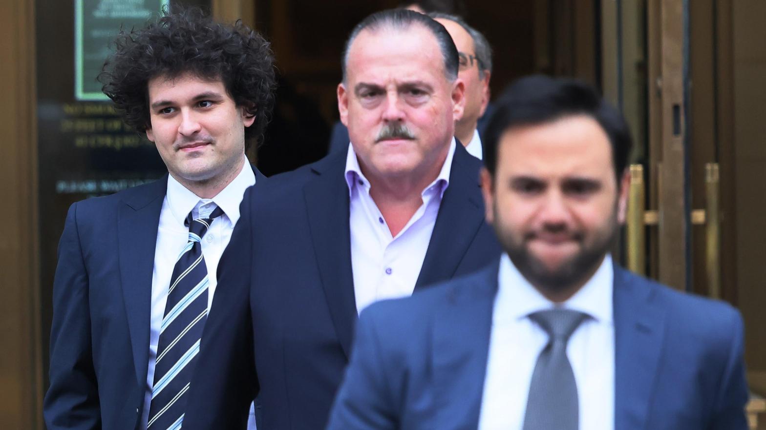 Sam Bankman-Fried, far left, was last in court Feb. 9. Prosecutors were concerned the failed FTX founder has been trying to communicate with encrypted messaging apps like Signal. (Photo: Michael M. Santiago, Getty Images)