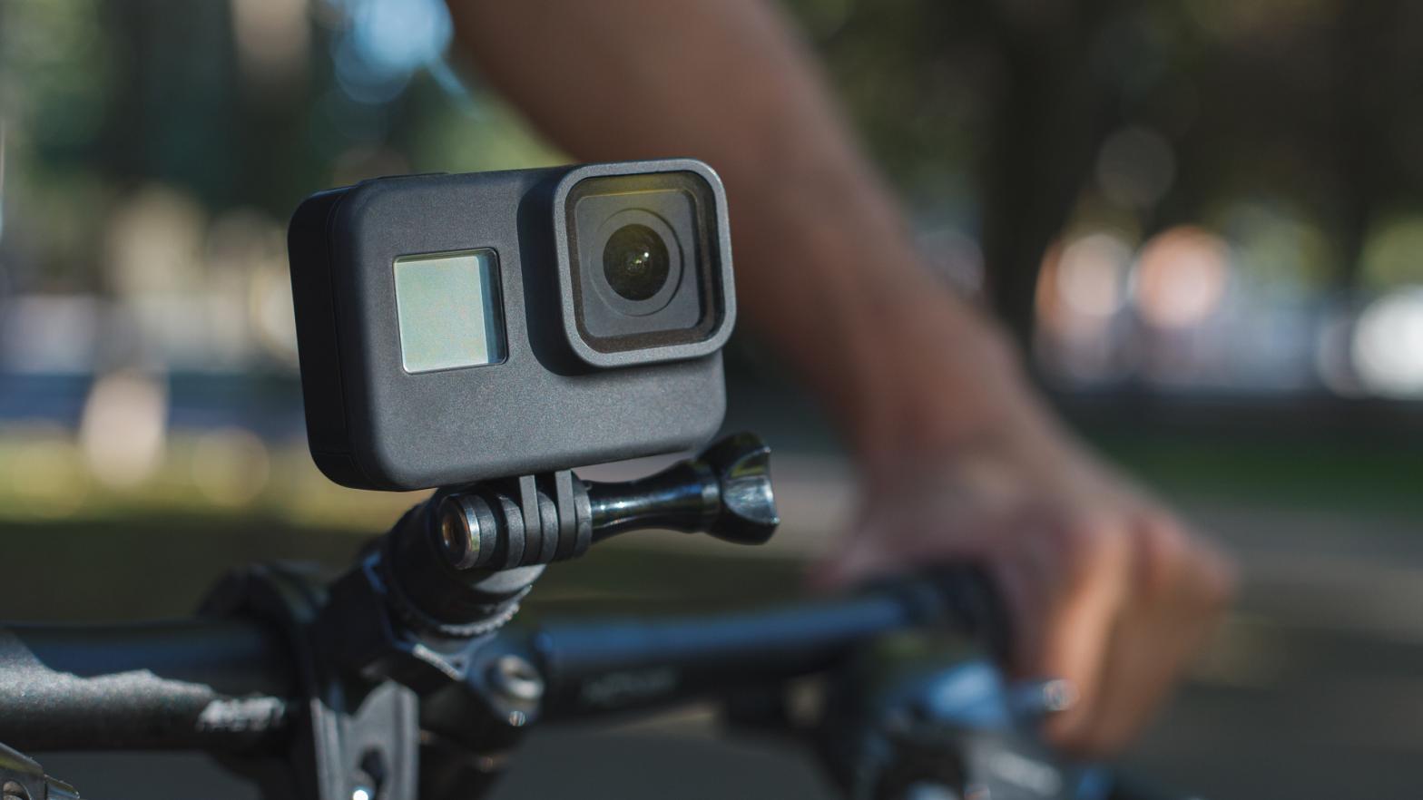 best Action camera mounted on the handlebar of a bicycle that a male cyclist is holding