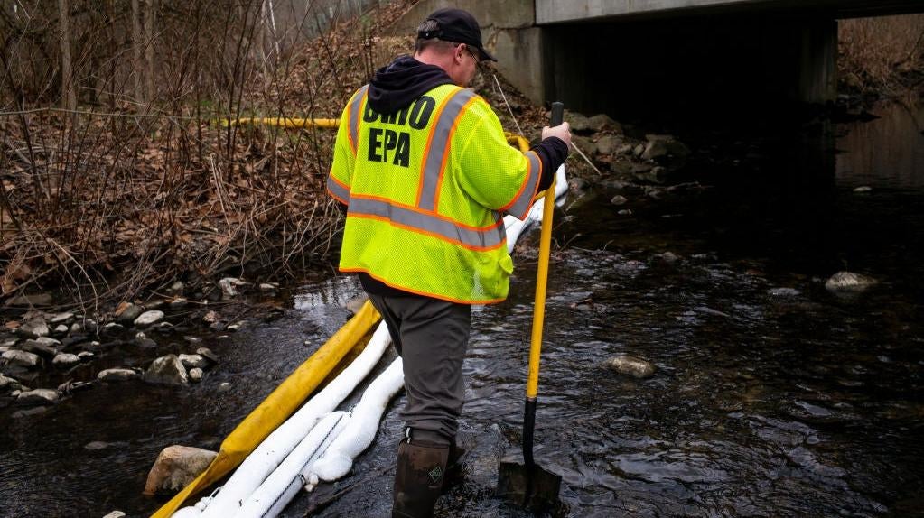 Ron Fodo, Ohio EPA Emergency Response, looks for signs of fish in Leslie Run creek to check for chemicals that have settled at the bottom following the train derailment  in East Palestine, Ohio. (Photo: Michael Swensen, Getty Images)