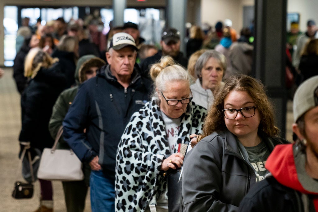 People wait in line at the Norfolk Southern Assistance Centre to collect a $US1,000 ($1,388) check and get reimbursed for expenses while they were evacuated.  (Photo: Michael Swensen, Getty Images)