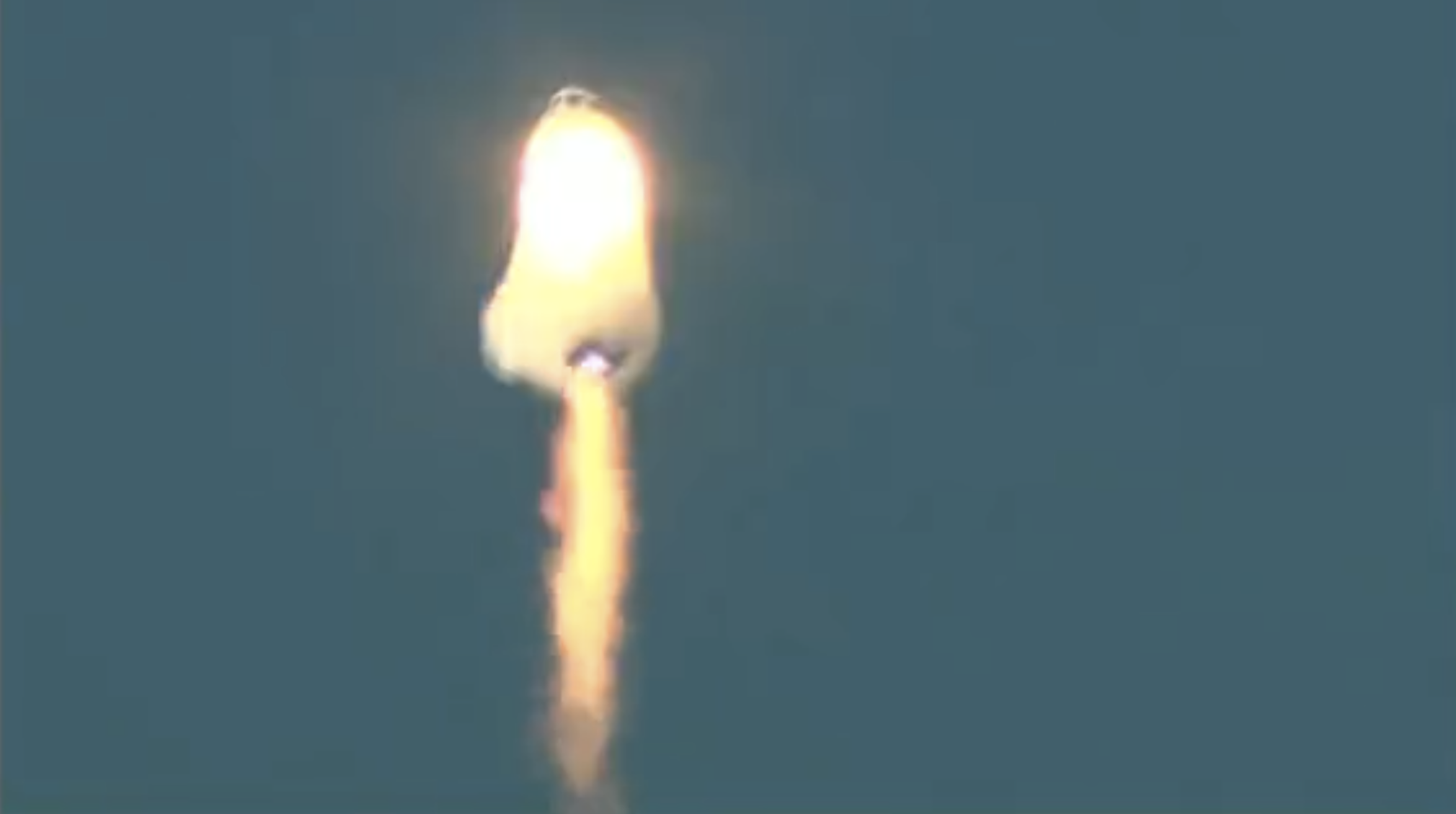 During the September 12 flight, New Shepard appeared to be completely enveloped in flame, prior to the capsule ejecting from the launch vehicle. (Screenshot: Blue Origin)