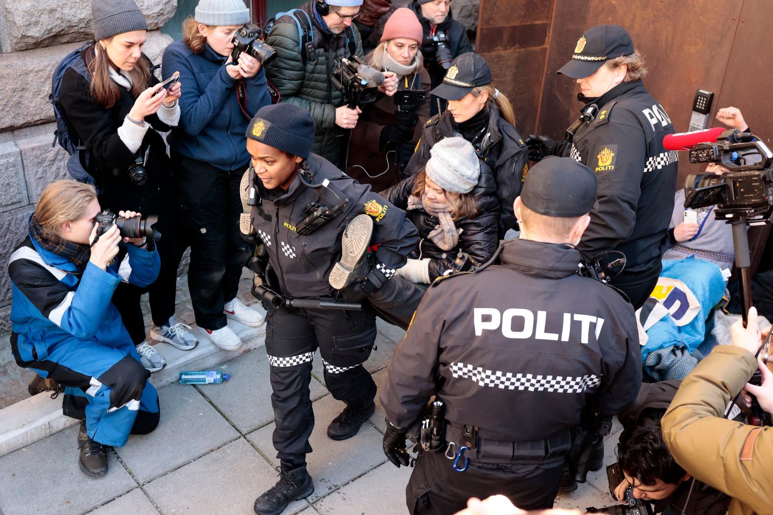 Greta Thunberg, centre, is carried away by police outside the Ministry of Finance on March 1, 2023. (Photo: Alf Simensen//NTB Scanpix, AP)