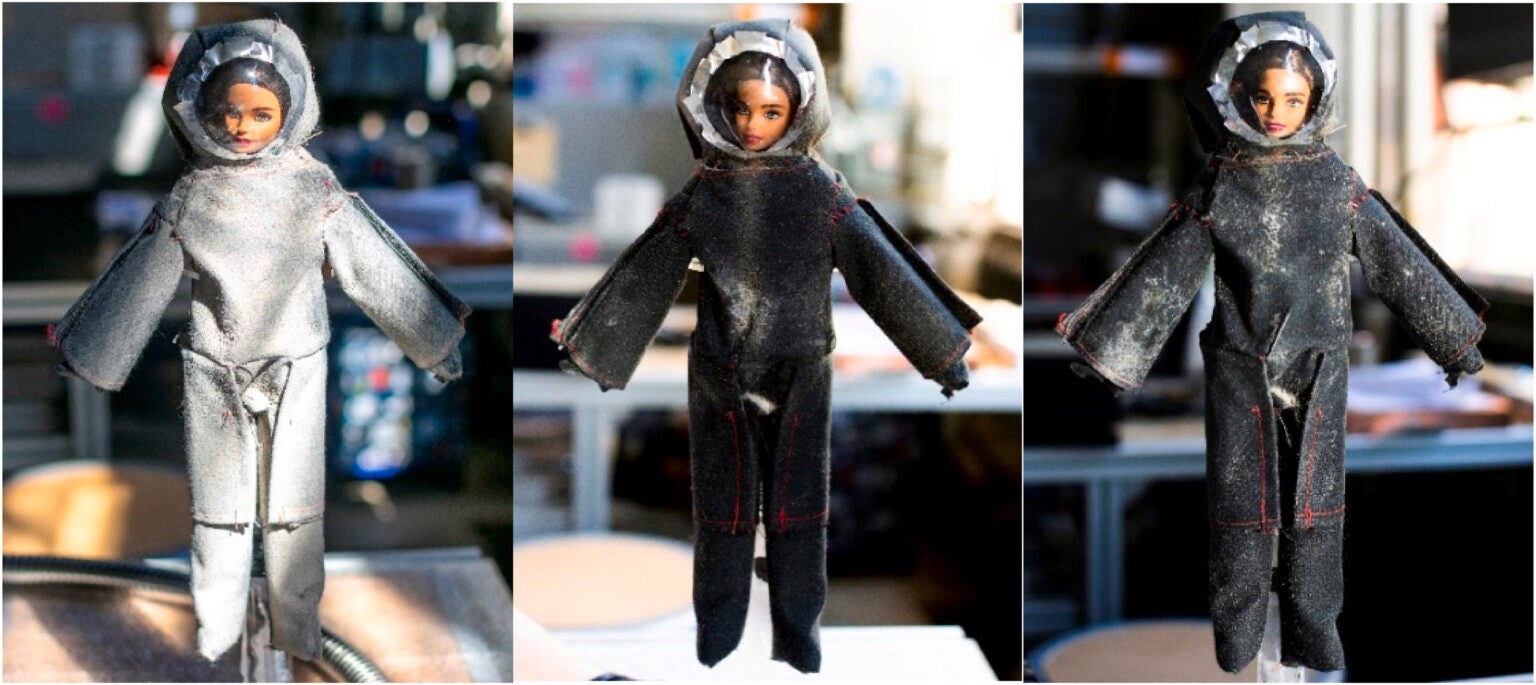 A Barbie doll stands in for a lunar astronaut and is covered in simulated Moon dust before cleaning (left), the doll after sweeping motions with the spray (middle) and after spot treatments (right).  (Image: I. Wells et al., 2023.)