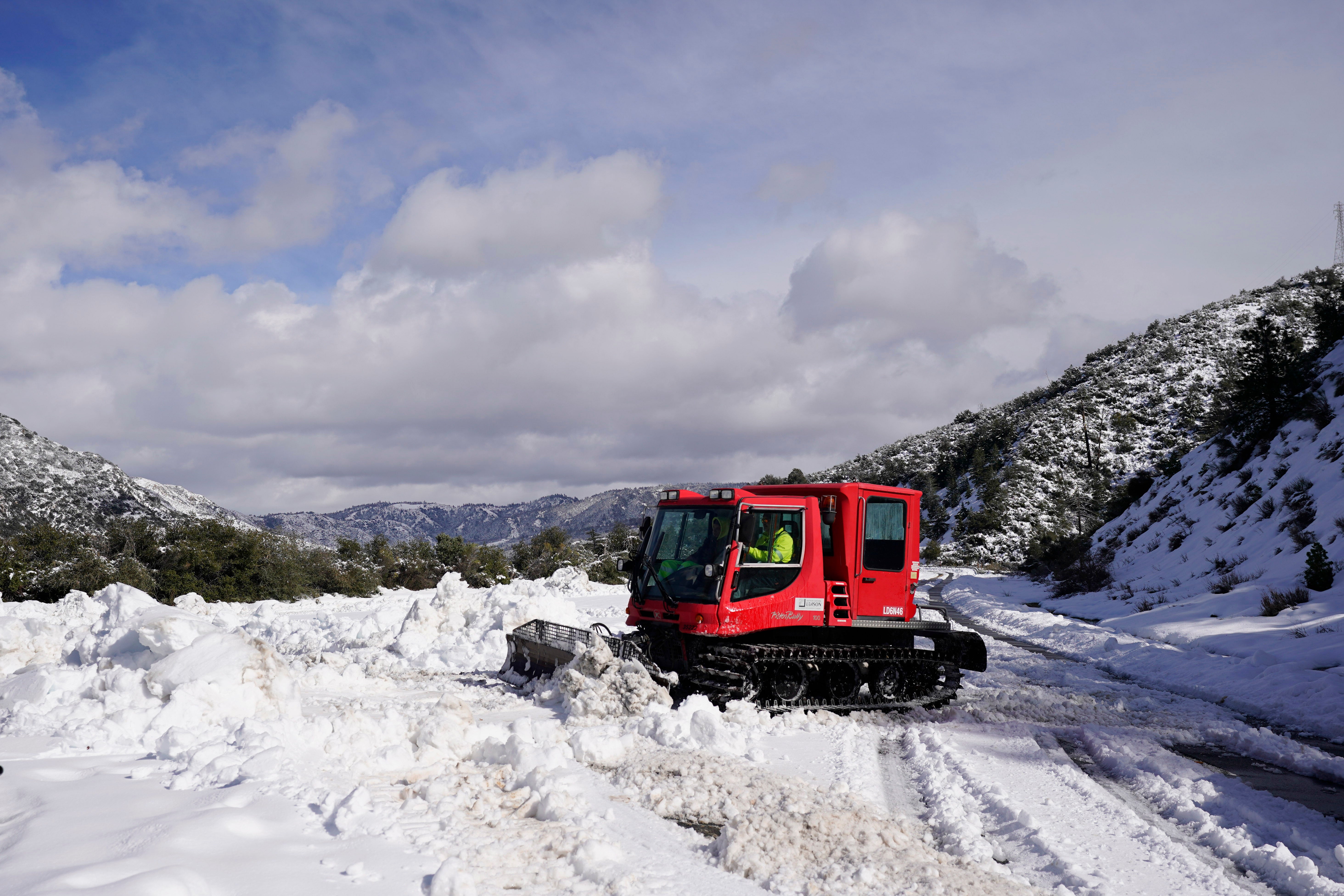 A worker plows snow along State Route 138 near Hesperia, California on Wednesday, March 1, 2023. (Photo: Jae C. Hong, AP)