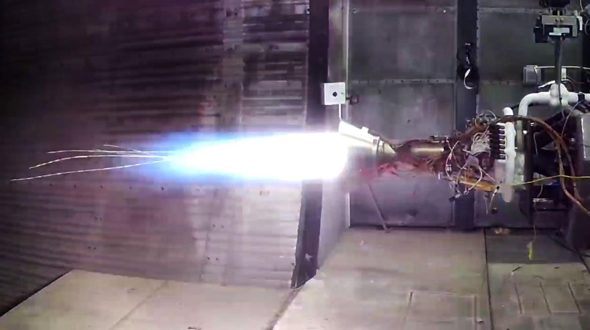 Tests of the upper stage engine resulted in burn-through and streaks of hot molten metal streaming out from the nozzle.  (Photo: Astra)