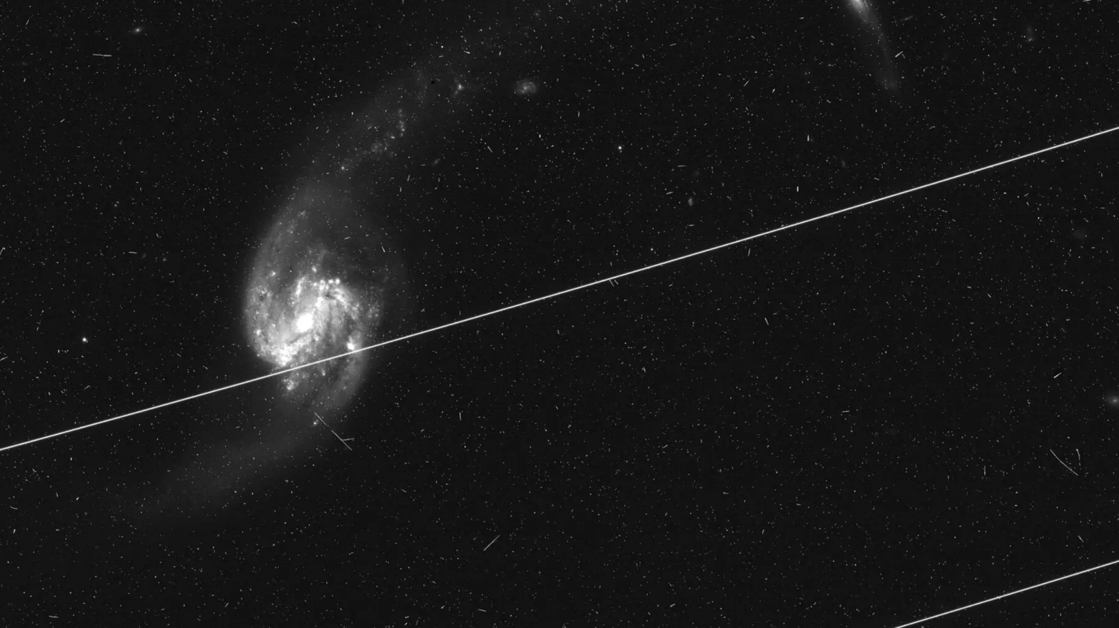 A Hubble image ruined by satellite streaks.  (Image: NASA/ESA/S. Kruk et al., 2023)