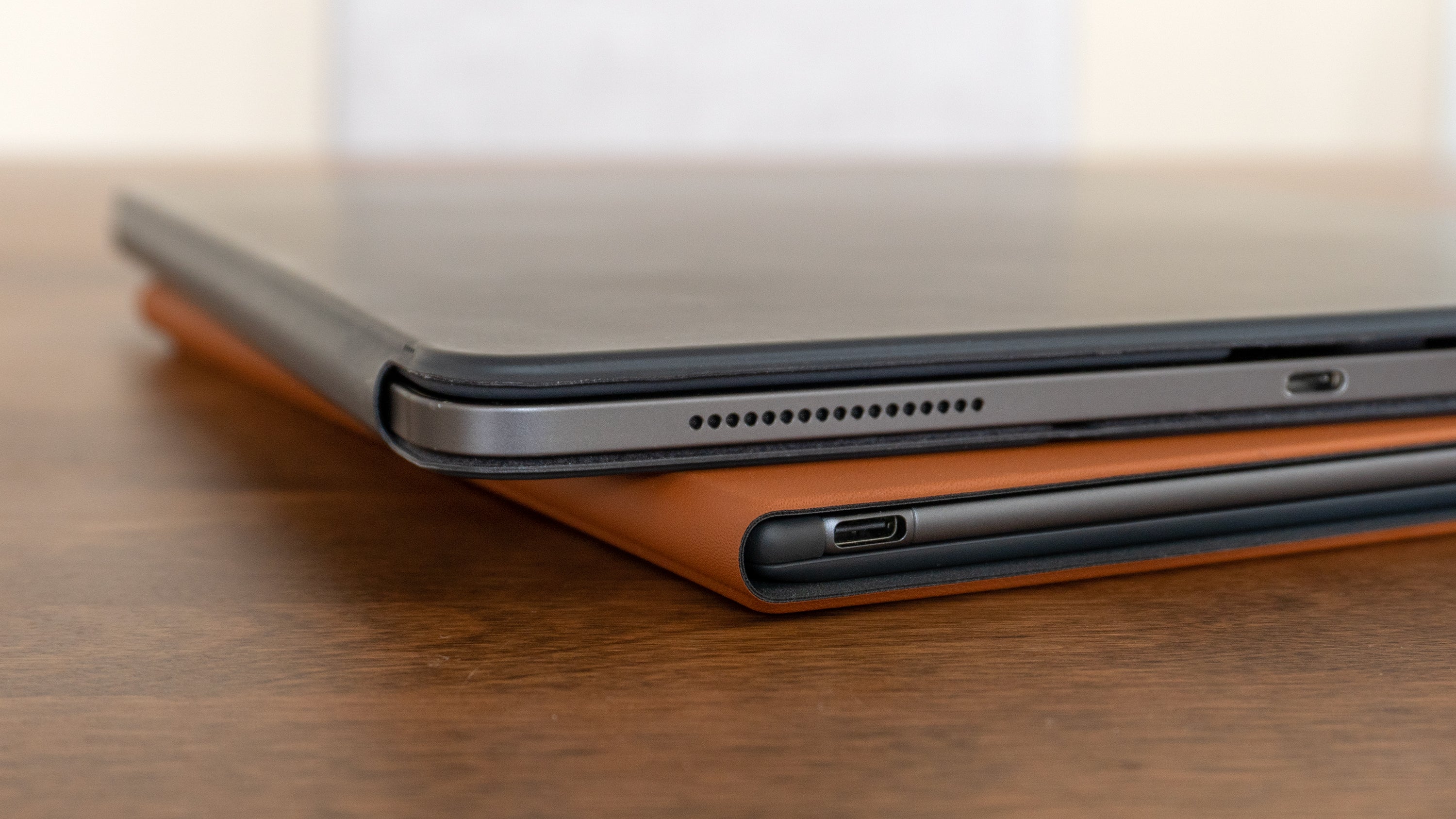 An iPad Pro with a closed keyboard case attached (top) compared to the reMarkable 2 in the Type Folio case (bottom). (Photo: Andrew Liszewski | Gizmodo)