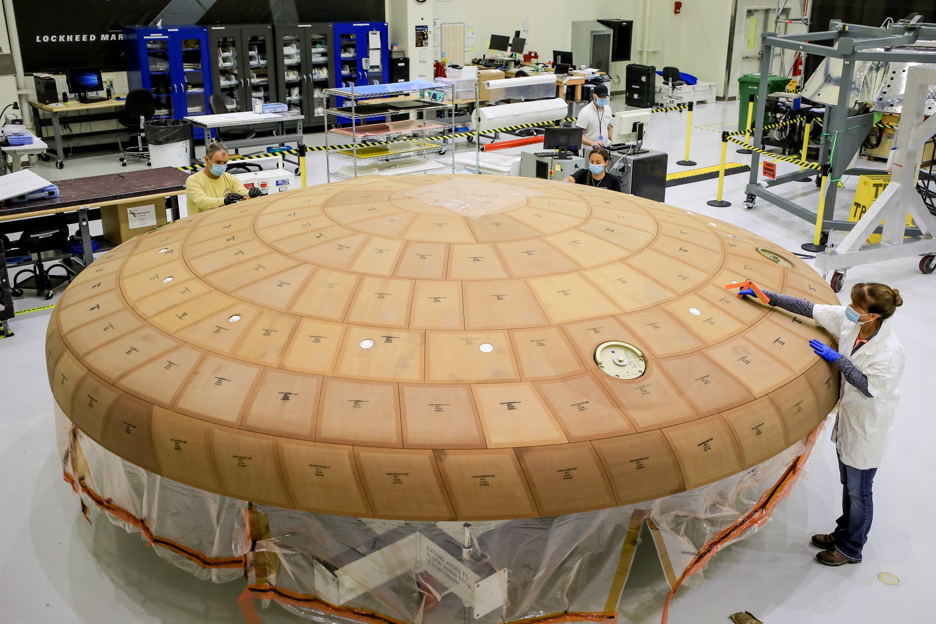 Engineering working on Orion's Artemis 2 heat shield.  (Photo: NASA)
