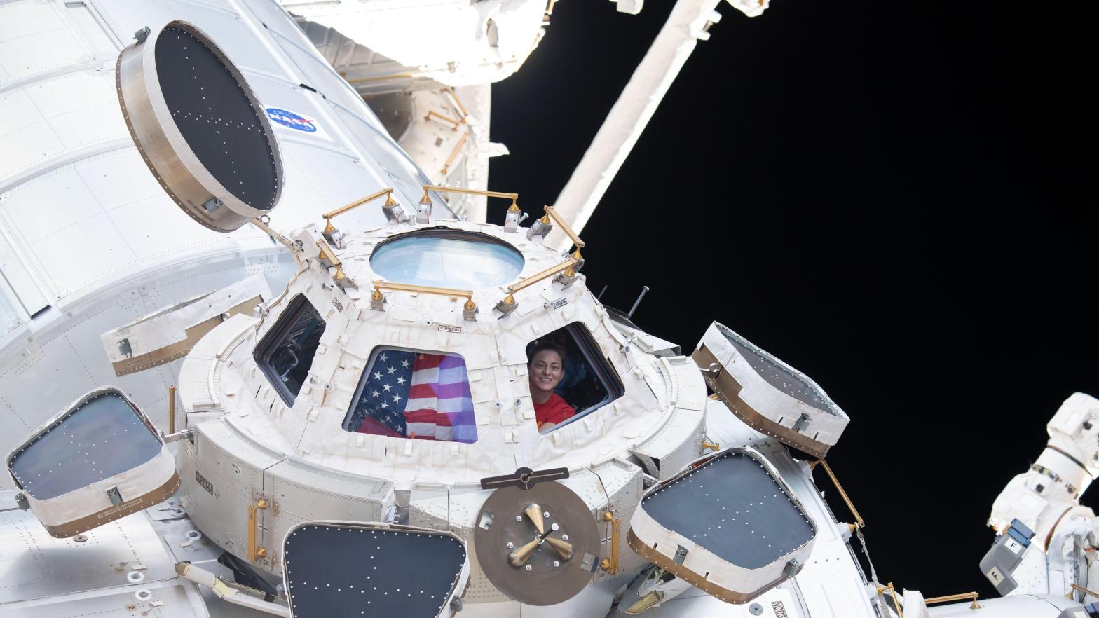 NASA astronaut Nicole Mann looking through the window of the ISS. (Image: NASA)