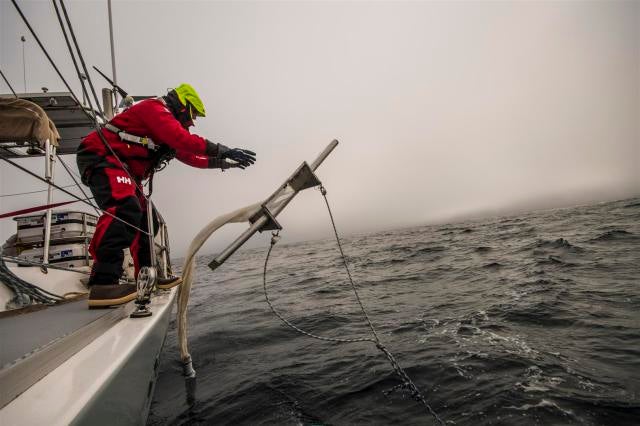 A researcher throws a trawl into the Atlantic Ocean during a 2014 expedition.  (Photo: 5 Gyres)