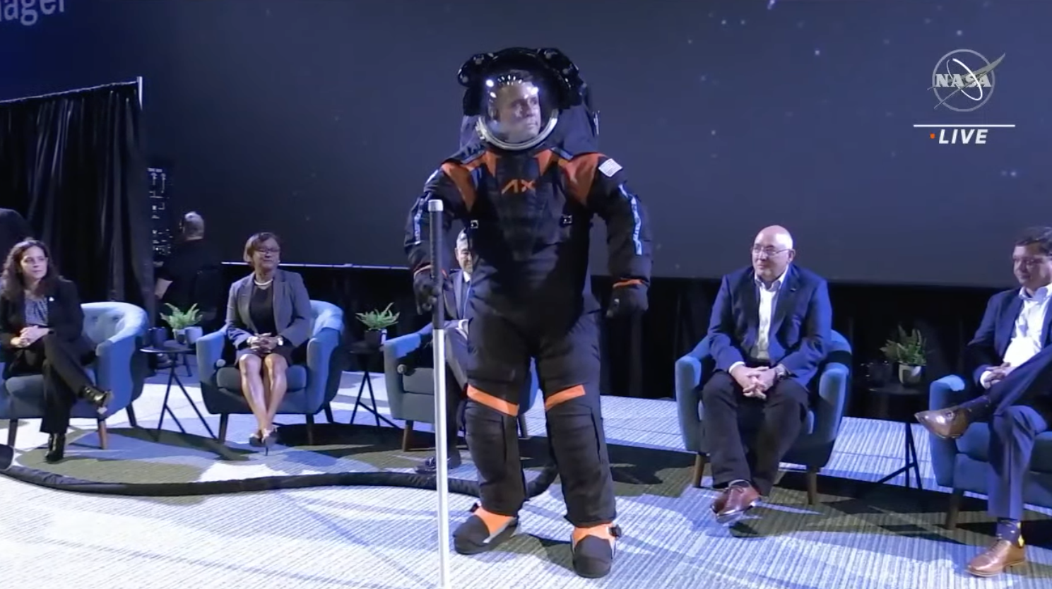 Jim Stein modelling the spacesuit during the event. (Screenshot: NASA TV)