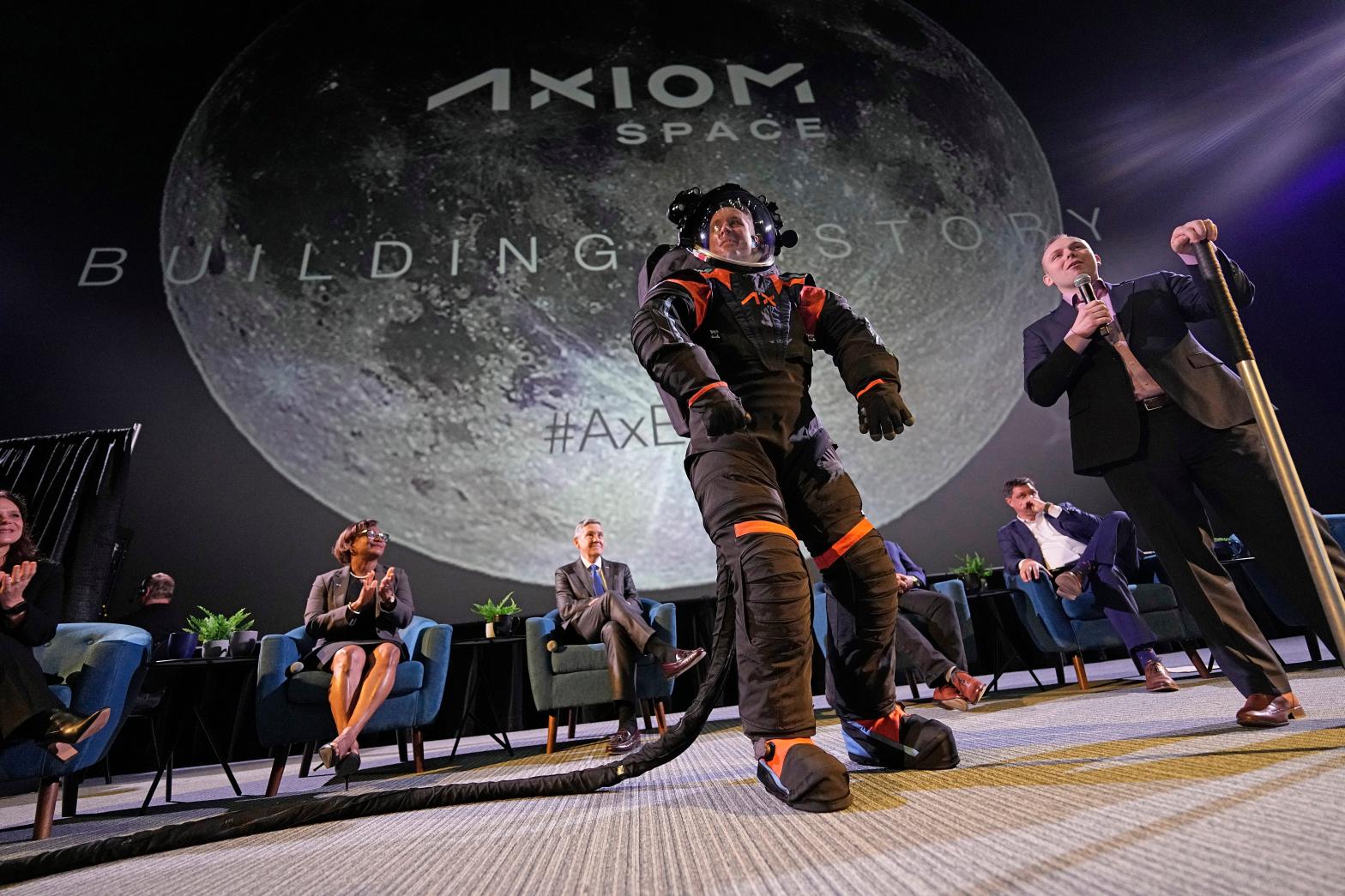 Axiom Space chief engineer Jim Stein demonstrating a prototype Moon suit, March 15, 2023. (Photo: David J. Phillip, AP)