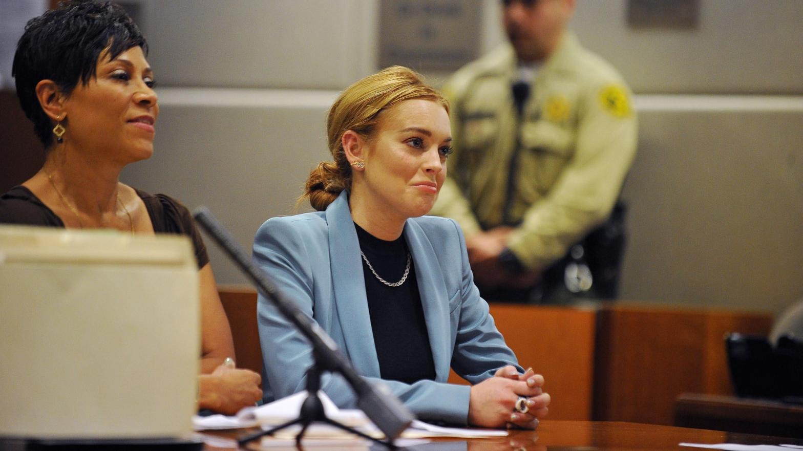 Lindsay Lohan attends her probation hearing with attorney Shawn Chapman Holley (L) at the Airport Courthouse on March 29, 2012 in Los Angeles, California. (Photo: Joe Klamer-Pool, Getty Images)