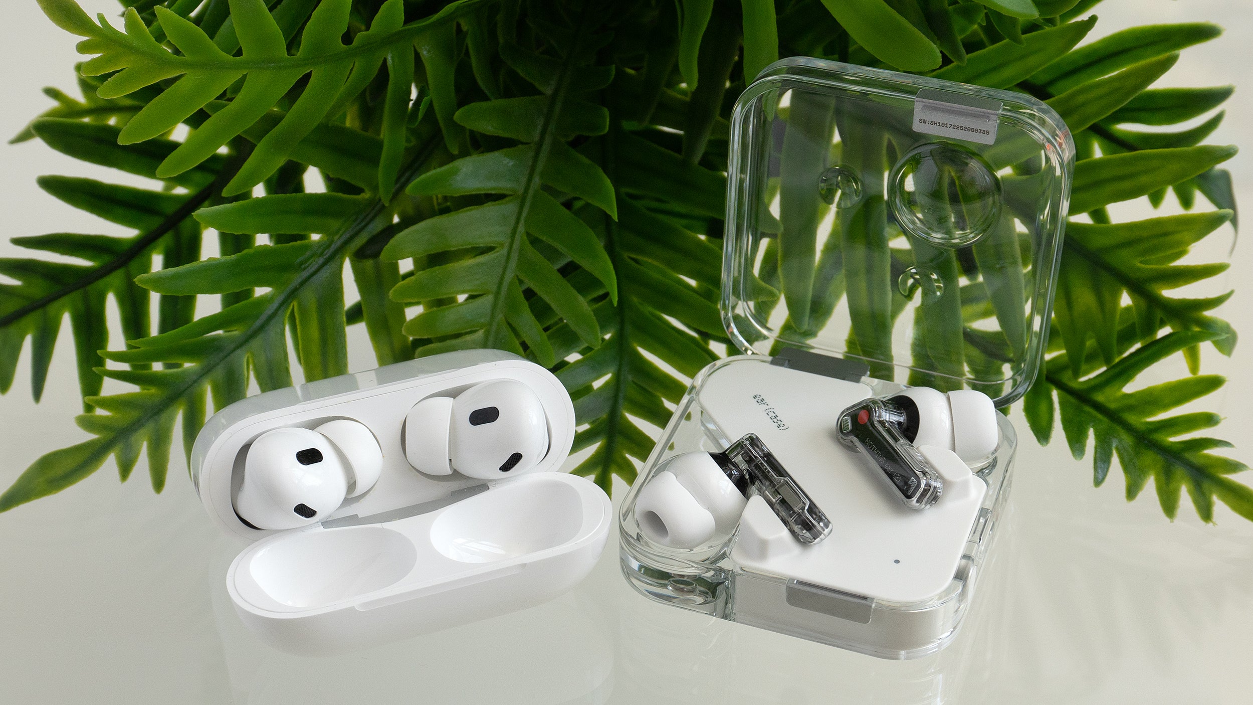 The Nothing Ear (2) (right) sound closer to the Apple AirPods Pro 2 (left) but their ANC performance is starting to fall behind. (Photo: Andrew Liszewski | Gizmodo)