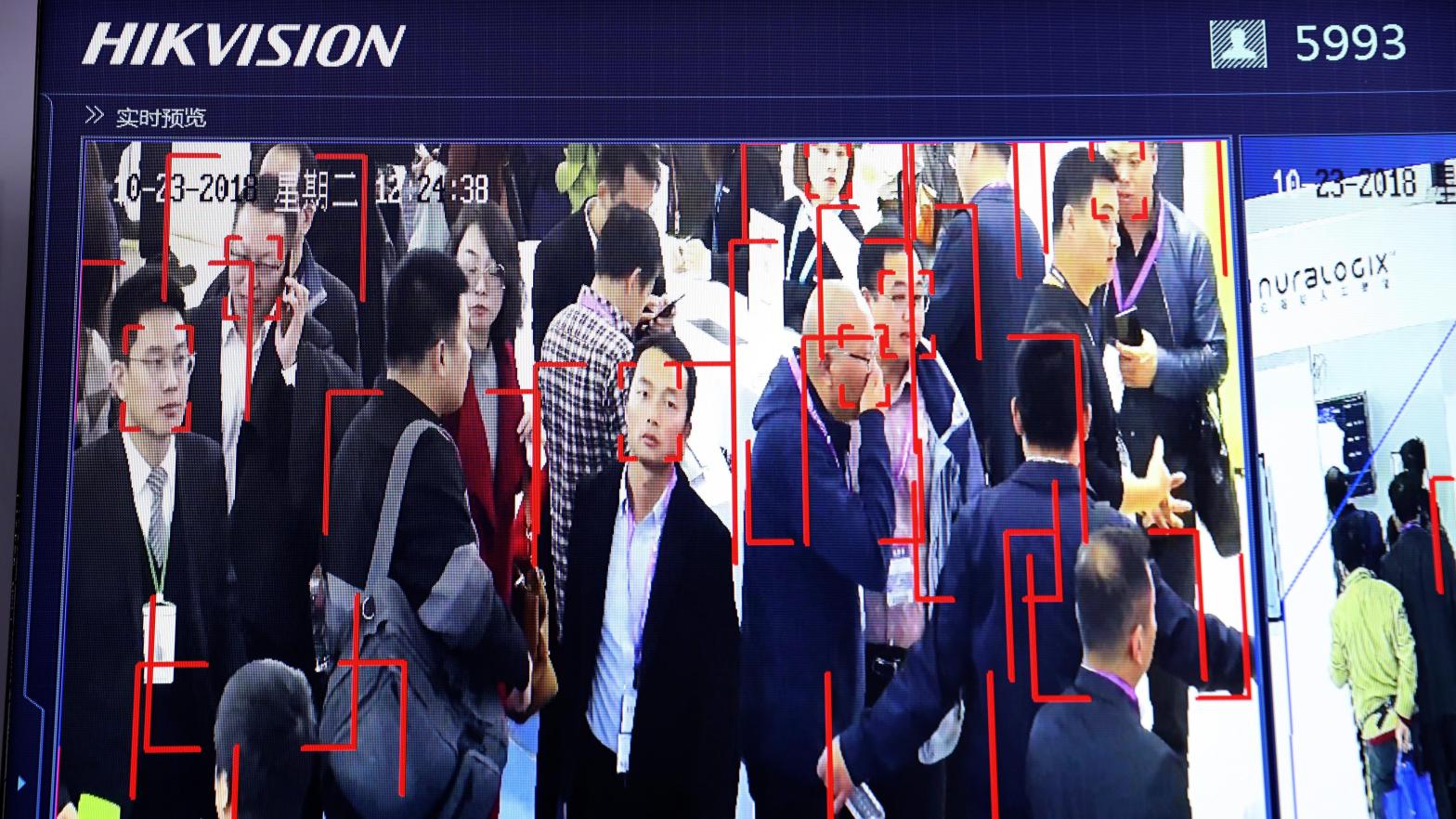 In this photo taken Tuesday, Oct. 23, 2018, visitors are tracked by facial recognition technology from state-owned surveillance equipment manufacturer Hikvision at the Security China 2018 expo in Beijing, China. (Photo: Ng Han Guan, AP)