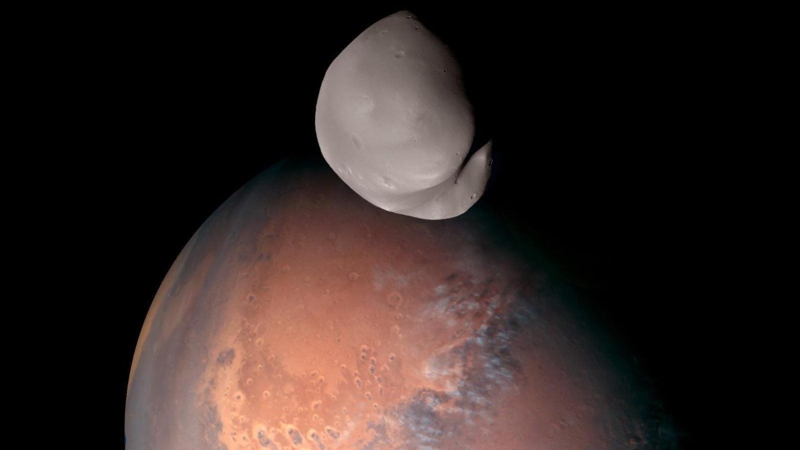 Composite image of Mars' moon Deimos as it orbits the planet taken by the Hope probe.  (Image: Mohammed Bin Rashid Space Centre)