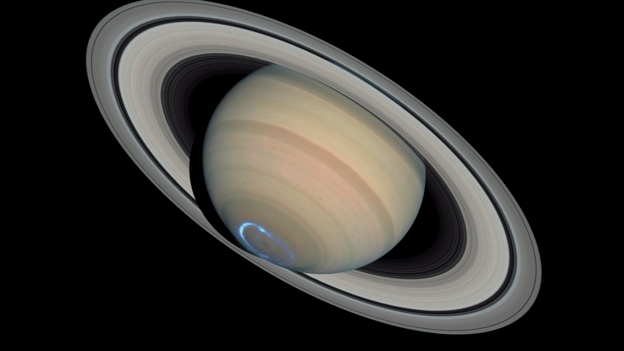 Researchers studied two years' worth of data to find 62 more Saturnian moons, bringing the planet's total to 145.  (Image: NASA, ESA, John T. Clarke (Boston University), Zolt G. Levay (STScI))