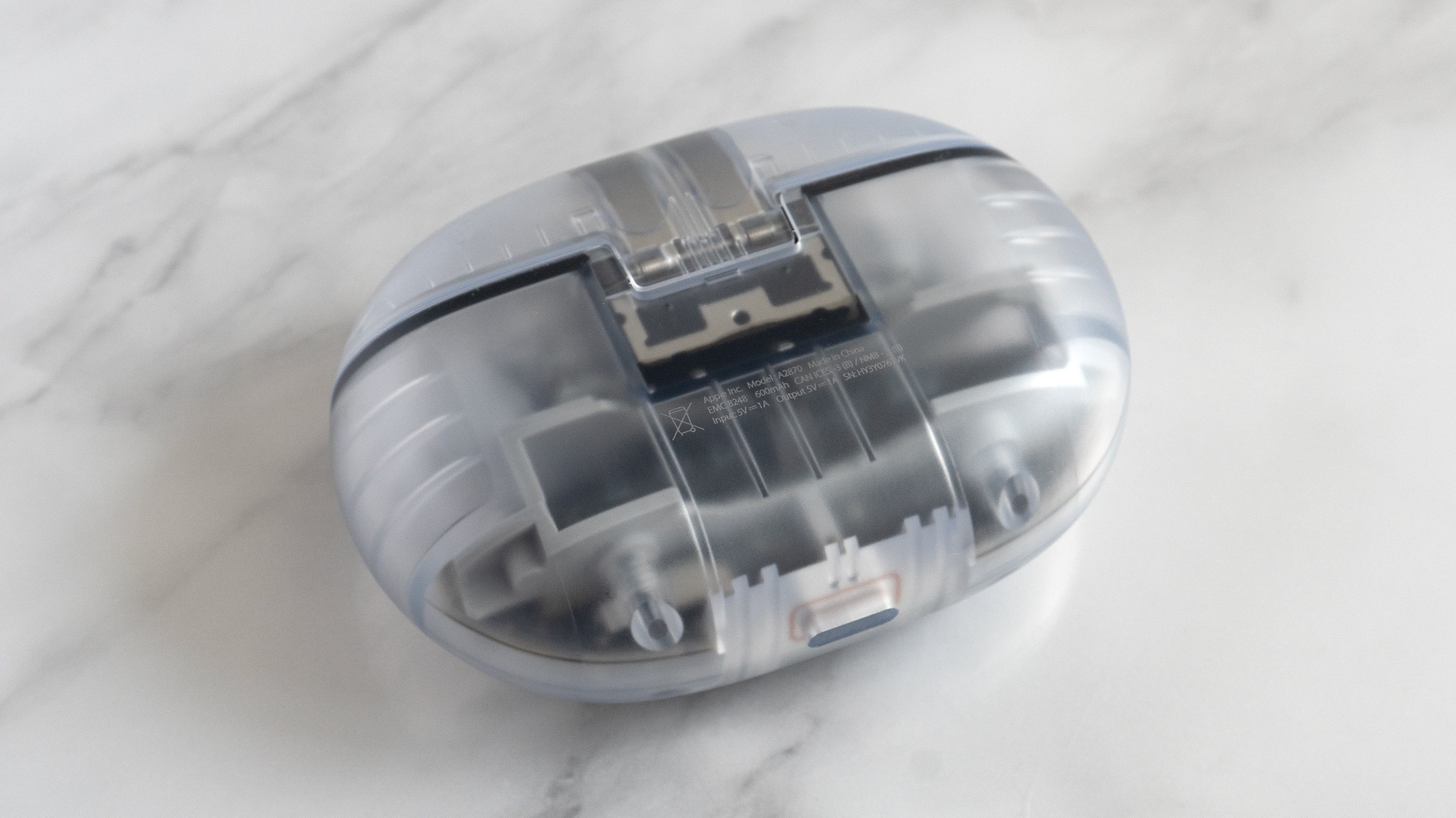 The Beats Studio Buds + charging case with its transparent housing might give airport FAA agents the wrong idea about what it is. (Photo: Andrew Liszewski | Gizmodo)