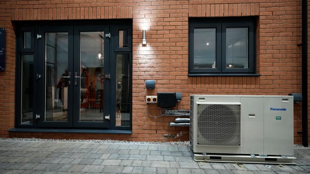Ground source heat pump sits outside a home. (Photo: Christopher Furlong, Getty Images)