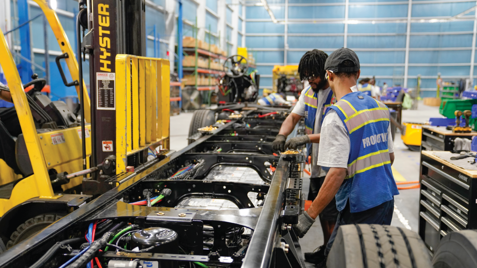 Workers at the new Blue Bird factory assembling electric school buses.  (Photo: Blue Bird)