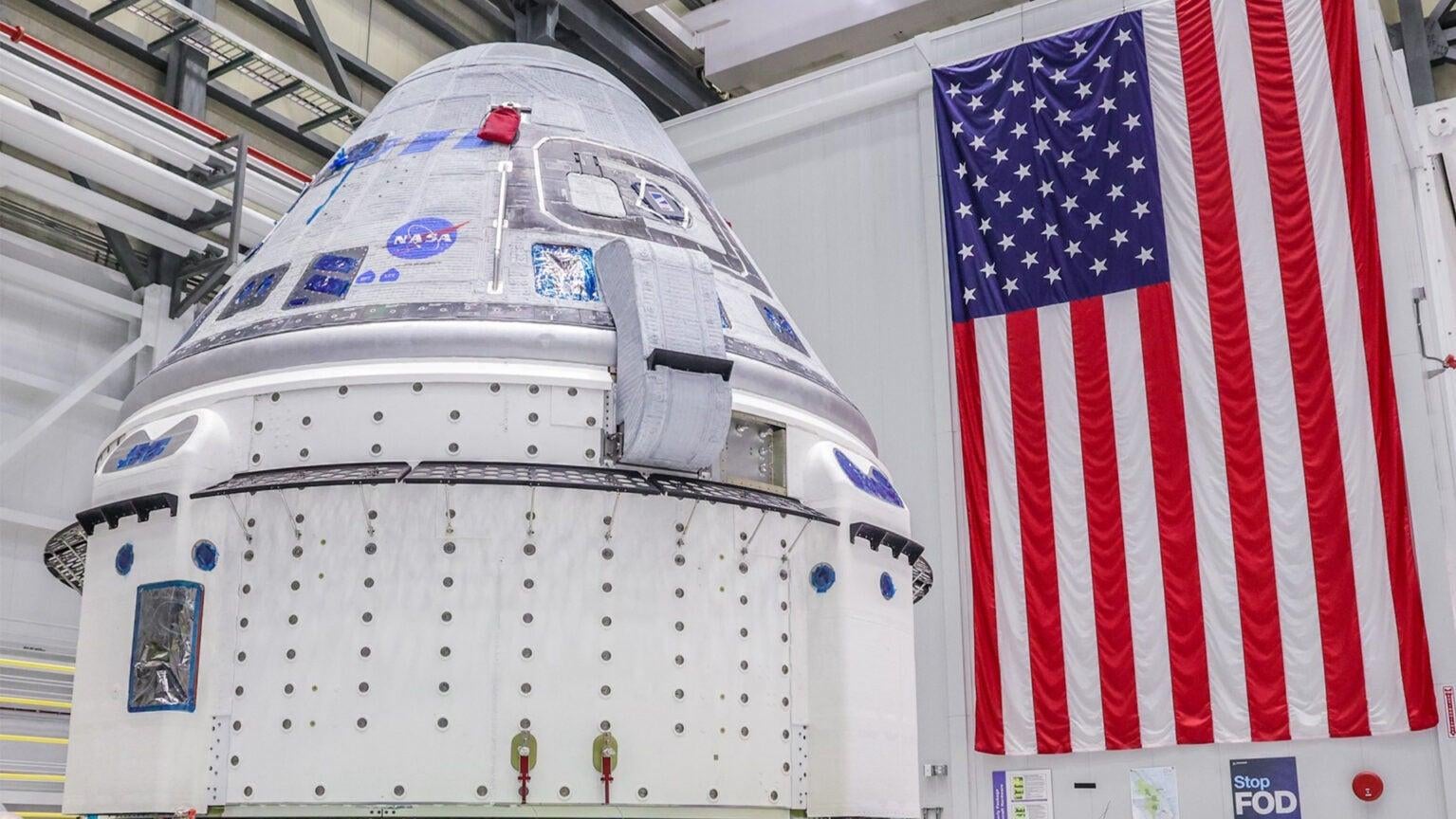 Crew Flight Test vehicle going into the Hazardous Processing Area in the Commercial Crew and Cargo Processing Facility in April 2023. (Photo: Boeing/John Grant)