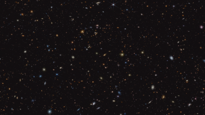 New Webb Image Reveals 45,000 Sparkling Galaxies in Ancient Star Formation
