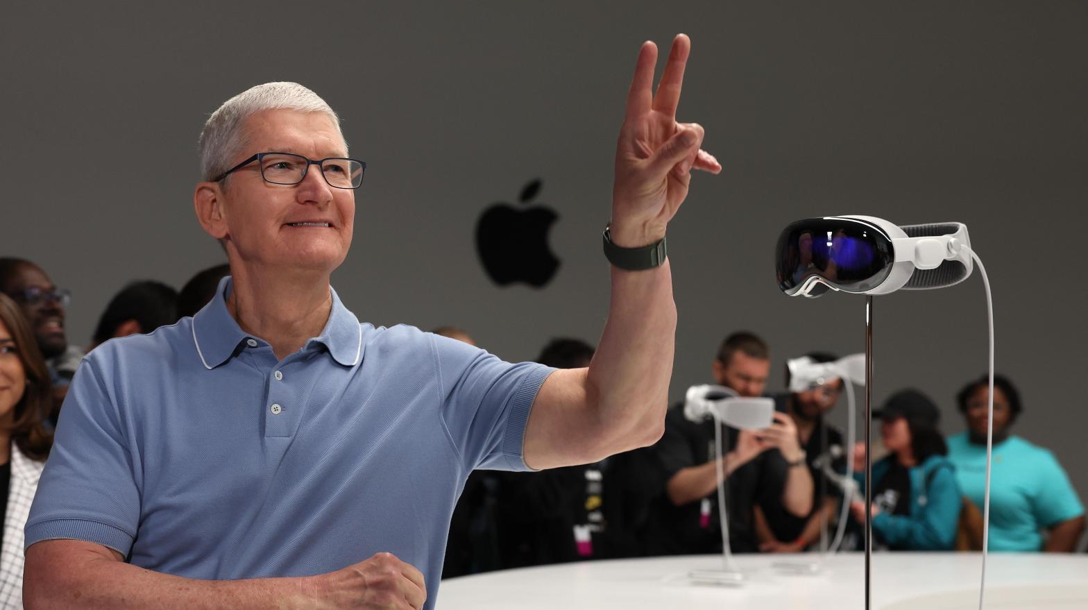 Apple CEO Tim Cook and other company big wigs did not strut around WWDC 2023 with their own premiered headset. Cook may be trying to save his eyes and his prescription glasses, though the company reportedly told guests magnetic prescription lenses are being sold separately.  (Photo: Justin Sullivan, Getty Images)