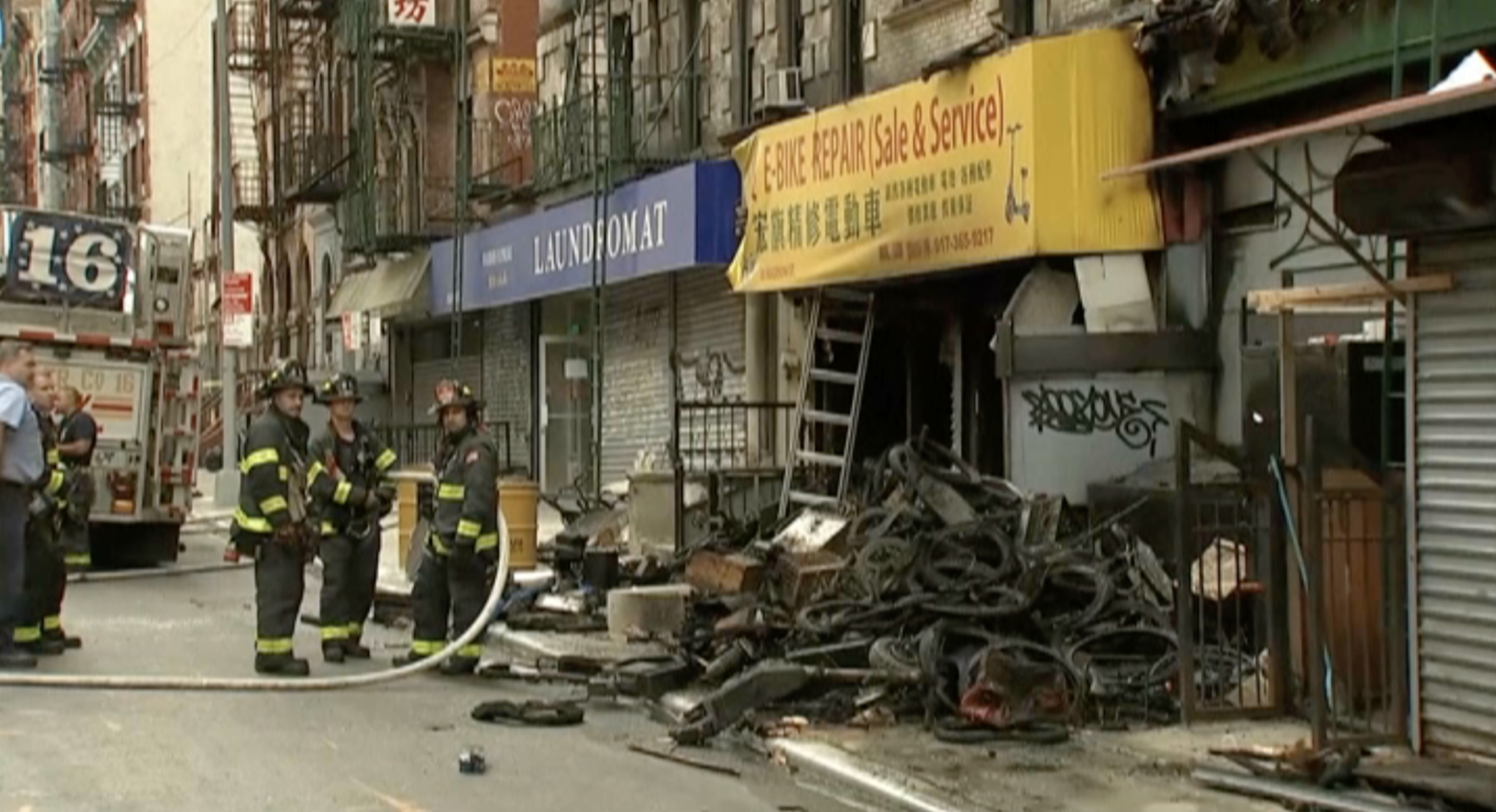 The store at 80 Madison Street was fined $US1,600 ($2,221) in 2022 for improper storage of lithium ion batteries, but remained open and operational.  (Screenshot: WABC-TV / Gizmodo, AP)