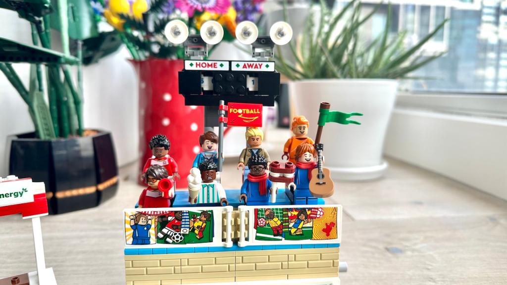 Fans cheer at the stand in the Icons of Play lego set
