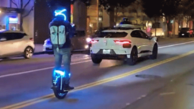 Watch a Robotaxi Drive Into Oncoming Lane to Avoid a Unicycle