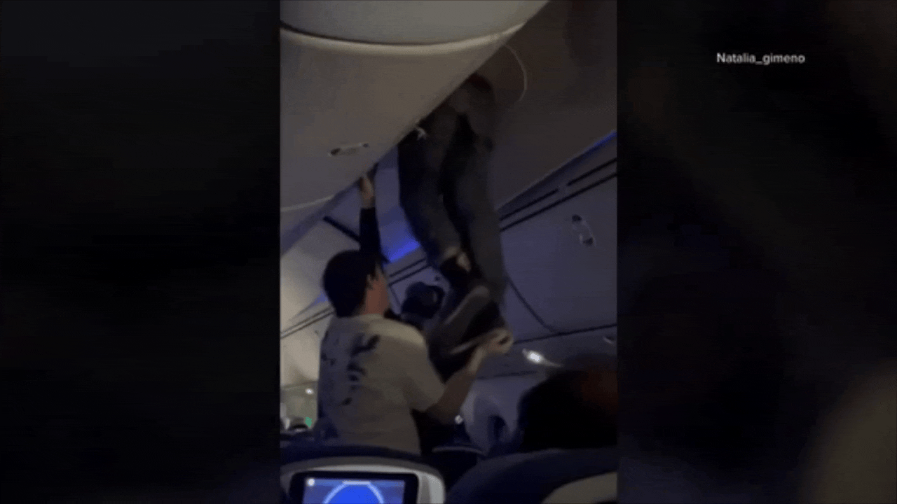 Scary Turbulence Sends Man Flying Into Overhead Bin in Viral Video